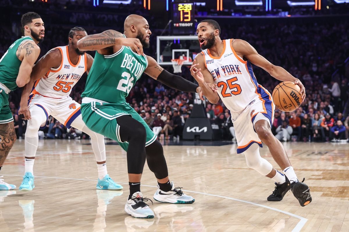 Feb 8, 2025; New York, New York, USA; New York Knicks forward Mikal Bridges (25) looks to drive past Boston Celtics forward Xavier Tillman (26) in the first quarter at Madison Square Garden. Mandatory Credit: Wendell Cruz-Imagn Images