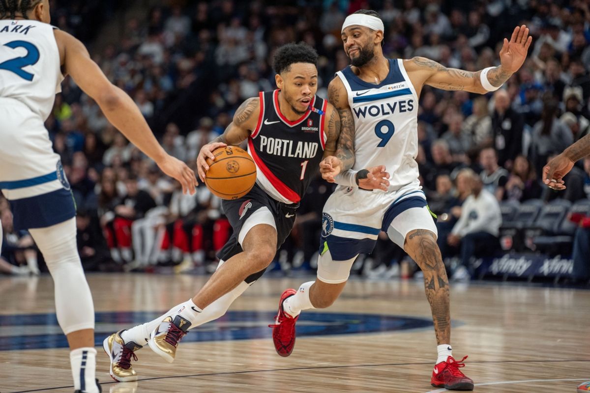 Feb 8, 2025; Minneapolis, Minnesota, USA; Portland Trail Blazers guard Anfernee Simons (1) dribbles against Minnesota Timberwolves guard Nickeil Alexander-Walker (9) in the second quarter at Target Center. Mandatory Credit: Matt Blewett-Imagn Images