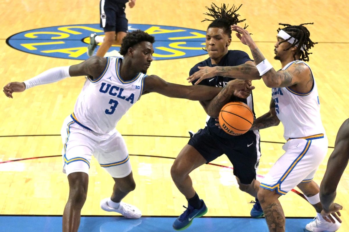 Feb 8, 2025; Los Angeles, California, USA;  UCLA Bruins guard Eric Dailey Jr. (3), guard Skyy Clark (55) and Penn State Nittany Lions guard Nick Kern Jr. (3) battle for a rebound in the first half at Pauley Pavilion presented by Wescom. Mandatory Credit: Jayne Kamin-Oncea-Imagn Images