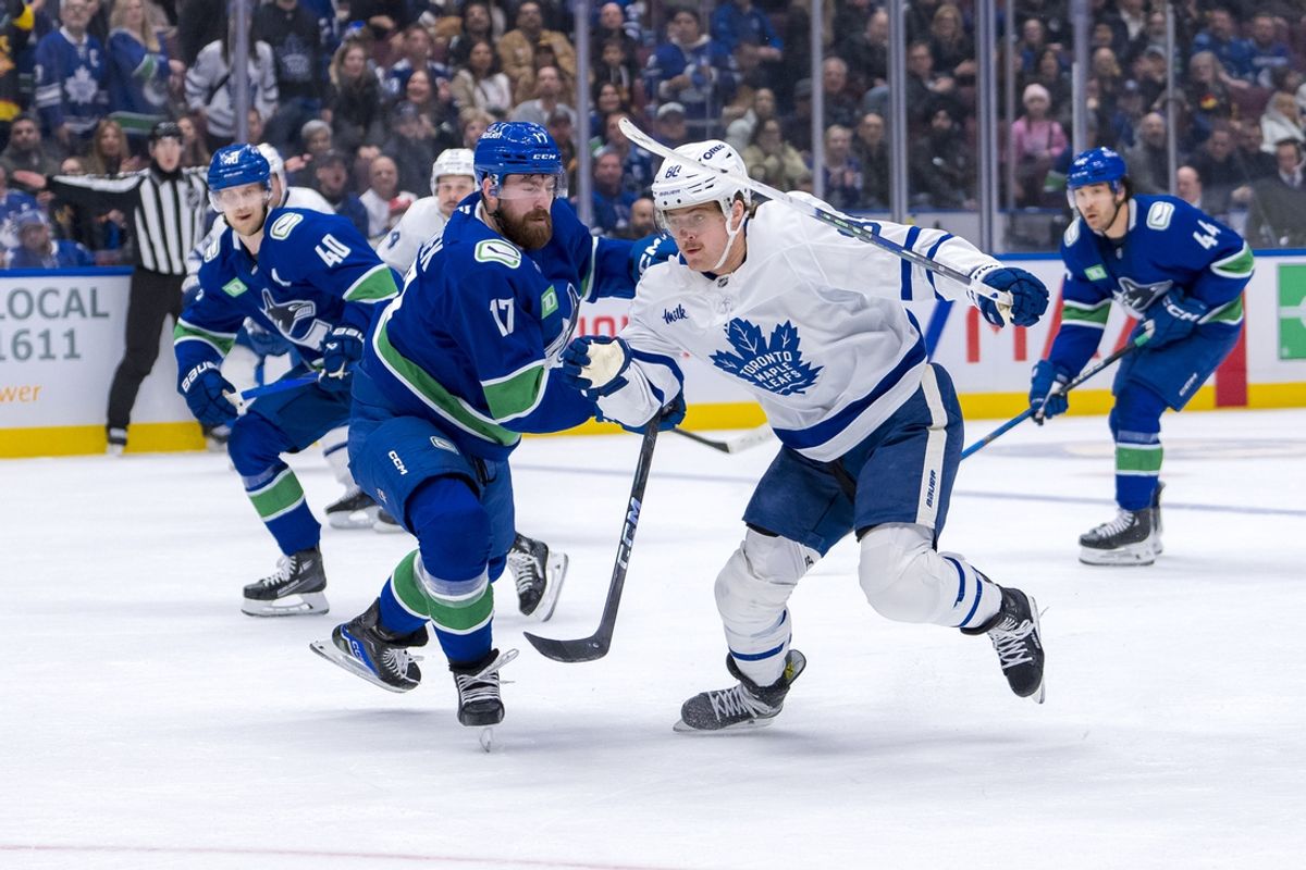 Feb 8, 2025; Vancouver, British Columbia, CAN; Toronto Maple Leafs forward William Nylander (88) drives past Vancouver Canucks defenseman Filip Hronek (17) in the third period at Rogers Arena. Mandatory Credit: Bob Frid-Imagn Images