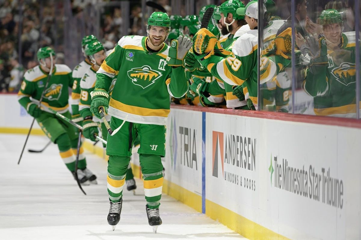 Feb 8, 2025; Saint Paul, Minnesota, USA;  Minnesota Wild forward Marcus Foligno (17) celebrates his empty net goal against the New York Islanders during the third period at Xcel Energy Center. Mandatory Credit: Nick Wosika-Imagn Images