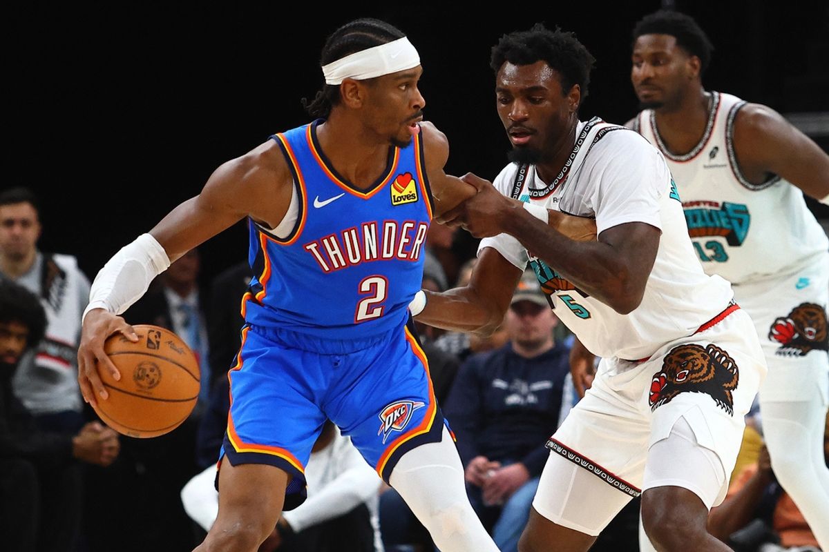 Feb 8, 2025; Memphis, Tennessee, USA; Oklahoma City Thunder guard Shai Gilgeous-Alexander (2) dribbles as Memphis Grizzlies guard Vince Williams Jr. (5) defends during the third quarter at FedExForum. Mandatory Credit: Petre Thomas-Imagn Images