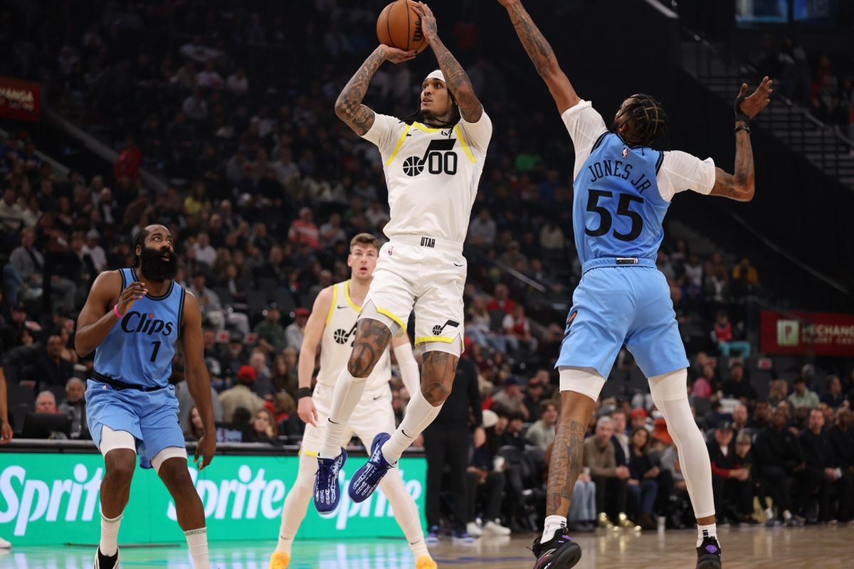 Feb 8, 2025; Inglewood, California, USA;  Utah Jazz guard Jordan Clarkson (00) shoots the ball against Los Angeles Clippers forward Derrick Jones Jr. (55) during the first quarter at Intuit Dome. Mandatory Credit: Kiyoshi Mio-Imagn Images