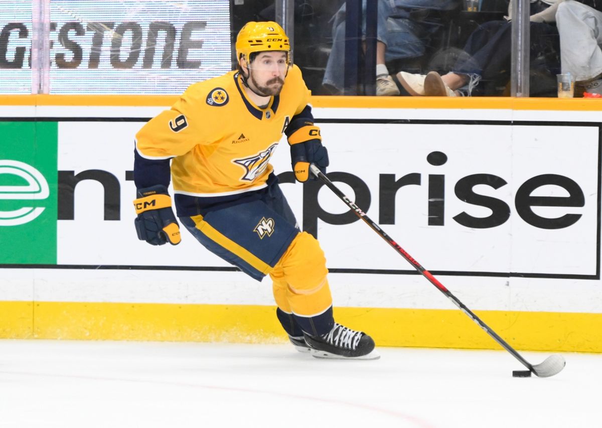 Feb 8, 2025; Nashville, Tennessee, USA;  Nashville Predators left wing Filip Forsberg (9) skates with the puck against the Buffalo Sabres during the third period at Bridgestone Arena. Mandatory Credit: Steve Roberts-Imagn Images