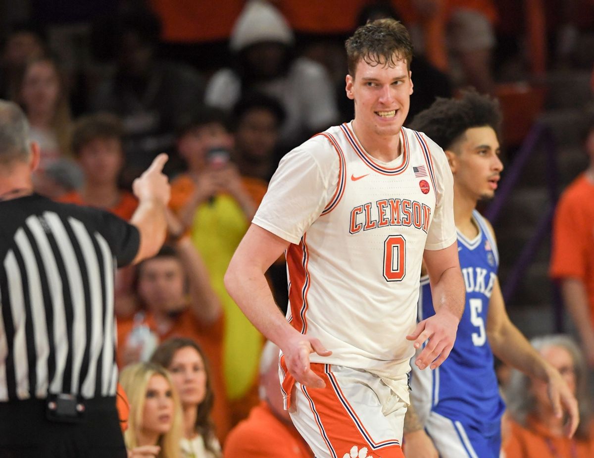 Feb 8, 2025; Clemson, South Carolina, USA; Clemson Tigers sophomore center Viktor Lakhin (0) smiles after a referee called a foul against him in the game with Duke Blue Devils during the second half at Littlejohn Coliseum.  Mandatory Credit: Ken Ruinard/USA Today Network via magn Images