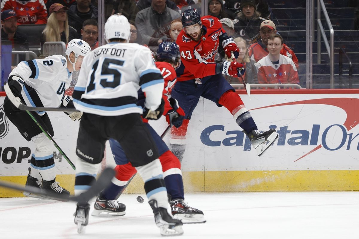 Feb 9, 2025; Washington, District of Columbia, USA; Washington Capitals right wing Tom Wilson (43) battles for the pick against the Utah Hockey Club during the first period at Capital One Arena. Mandatory Credit: Amber Searls-Imagn Images