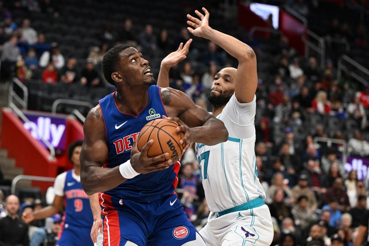 Feb 9, 2025; Detroit, Michigan, USA;  Detroit Pistons center Jalen Duren (0) tries to score on Charlotte Hornets forward Taj Gibson (67) in the second quarter at Little Caesars Arena. Mandatory Credit: Lon Horwedel-Imagn Images