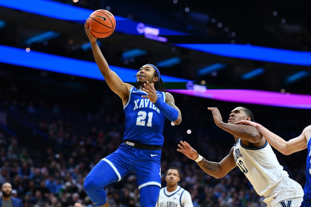 Feb 9, 2025; Philadelphia, Pennsylvania, USA; Xavier Musketeers guard Dante Maddox Jr (21) drives to shoot against the Villanova Wildcats in the first half at Wells Fargo Center. Mandatory Credit: Kyle Ross-Imagn Images