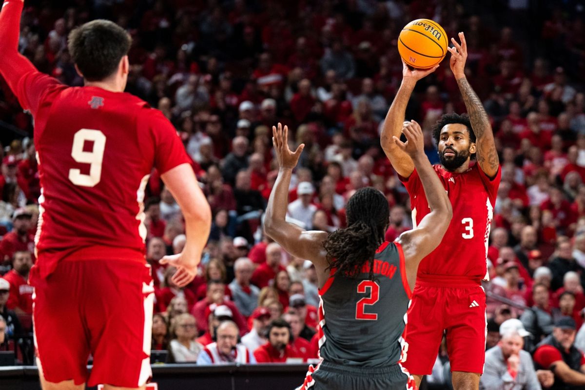 Feb 9, 2025; Lincoln, Nebraska, USA; Nebraska Cornhuskers guard Brice Williams (3) passes to forward Berke Buyuktuncel (9) against Ohio State Buckeyes guard Bruce Thornton (2) during the first half at Pinnacle Bank Arena. Mandatory Credit: Dylan Widger-Imagn Images