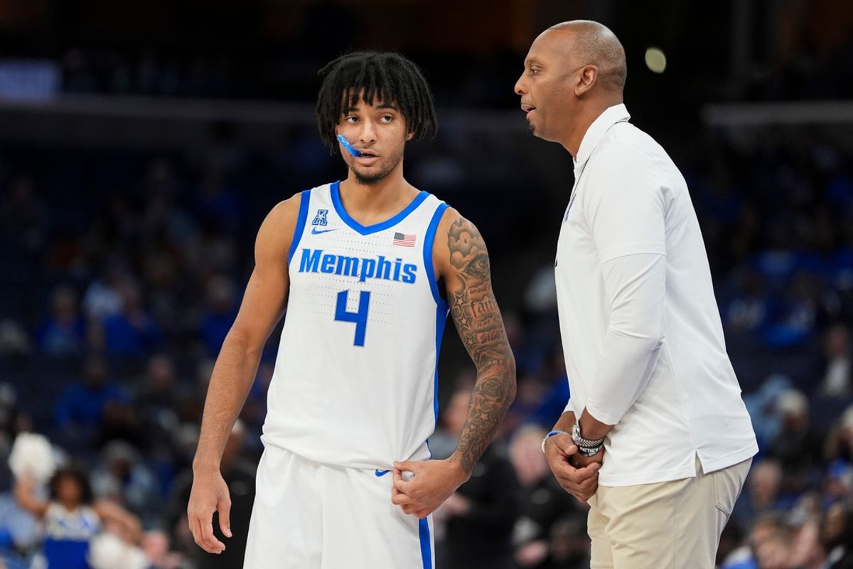 Memphis' PJ Haggerty (4) speaks with head coach Penny Hardaway during the game between Temple University and the University of Memphis at FedExForum in Memphis, Tenn., on Sunday, February 9, 2025.