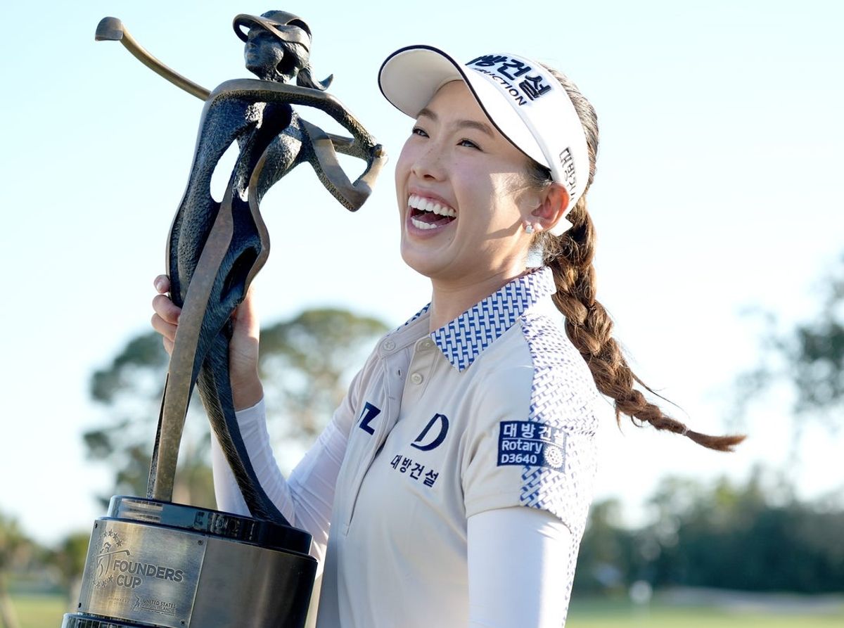 Yealimi Noh, 23, American golfer, with her trophy after winning the Founders Cup presented by U.S. Virgin Islands 2025 at Bradenton Country Club on February 09, 2025 in Bradenton, Florida.