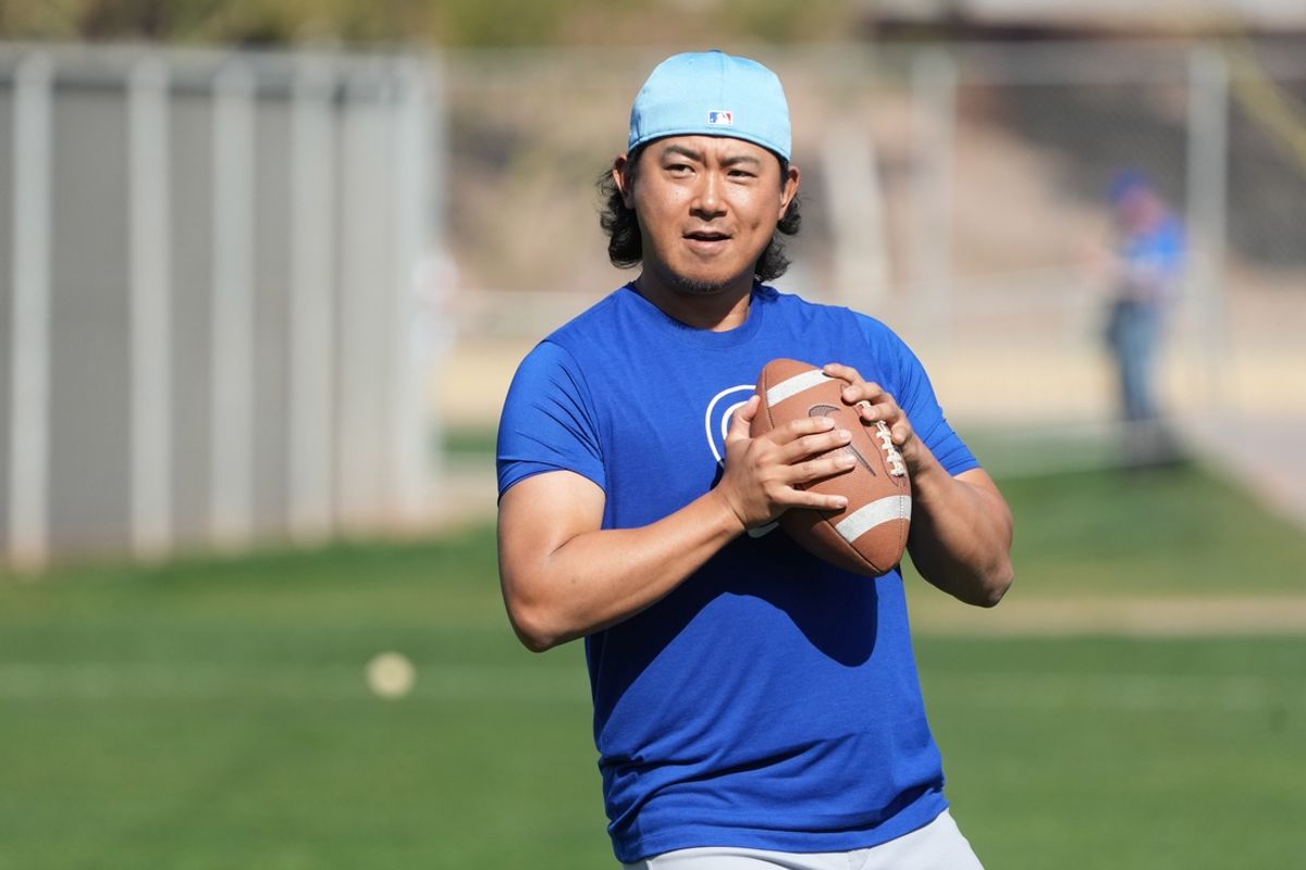 Feb 10, 2025; Mesa, AZ, USA; Chicago Cubs pitcher Shota Imanaga (18) runs through drills during spring training camp. Mandatory Credit: Rick Scuteri-Imagn Images