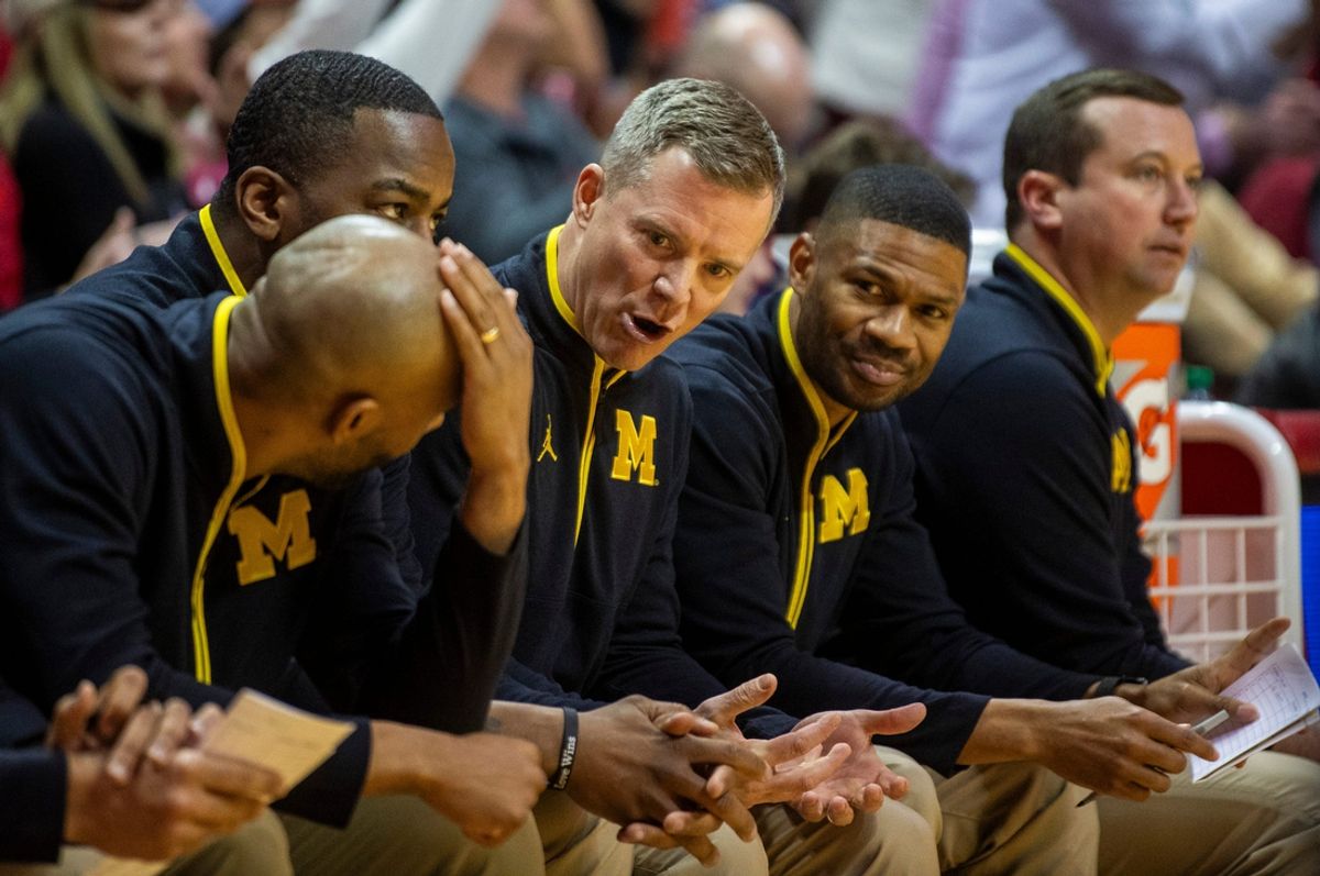 Michigan Head Coach Dusty May talks with coaches during the Indiana versus Michigan men's basketball game at Simon Skjodt Assembly Hall on Saturday, Feb. 8, 2025.