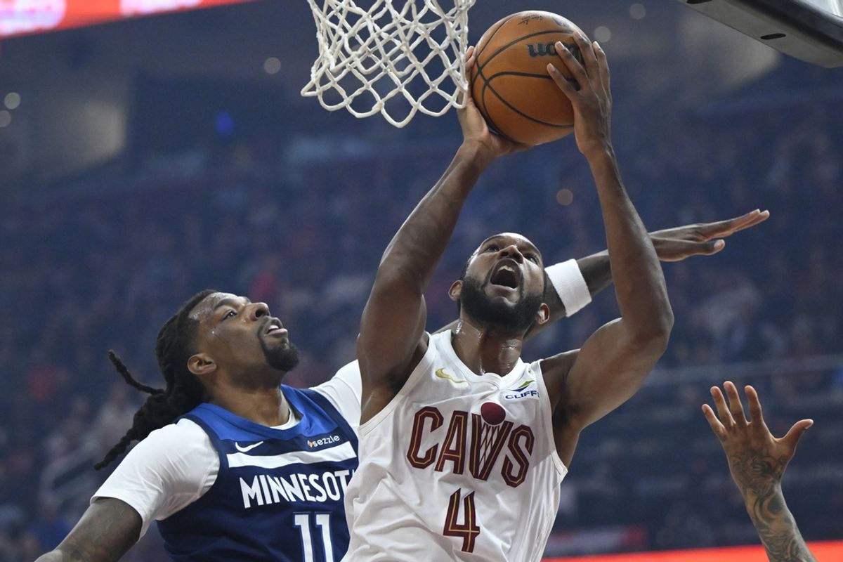 Feb 10, 2025; Cleveland, Ohio, USA; Cleveland Cavaliers forward Evan Mobley (4) shoots beside Minnesota Timberwolves center Naz Reid (11) in the first quarter at Rocket Mortgage FieldHouse. Mandatory Credit: David Richard-Imagn Images