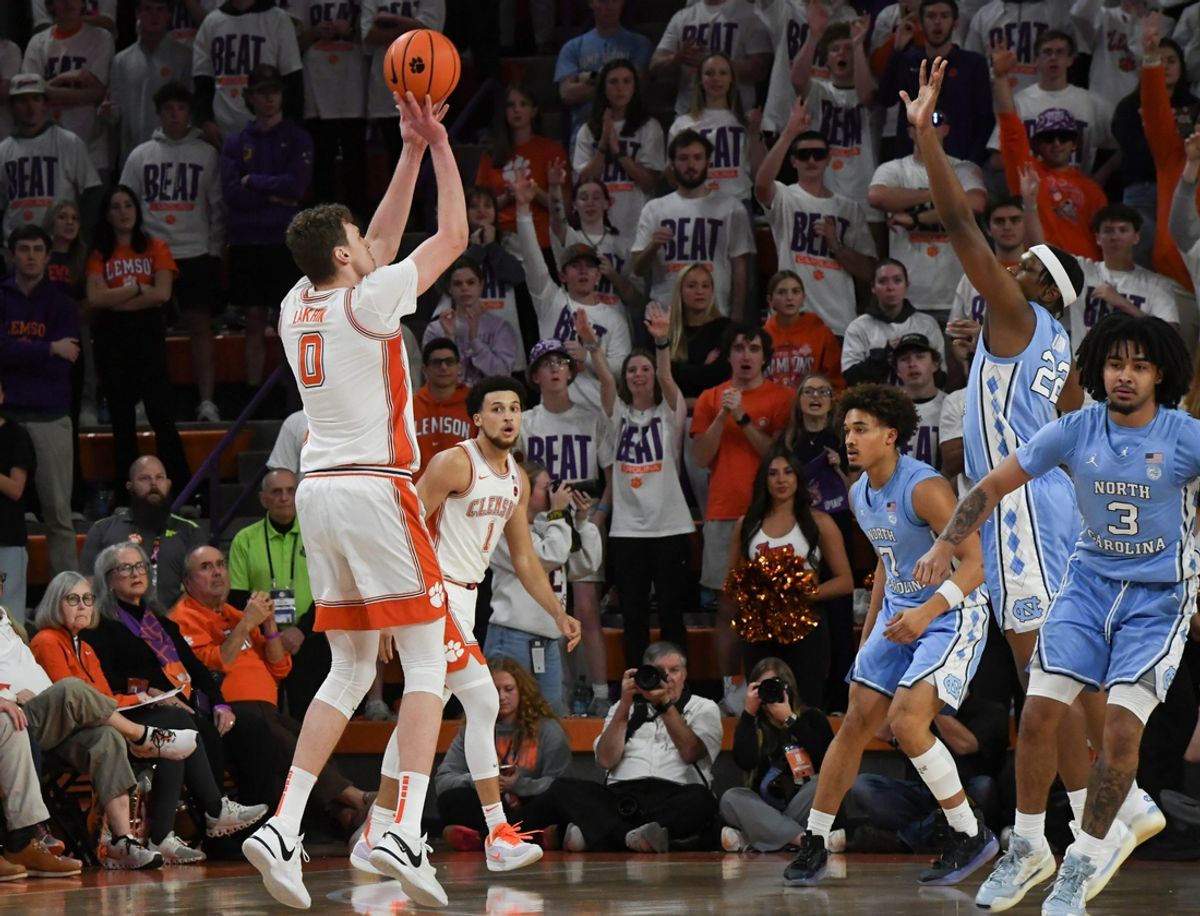 Clemson sophomore center Viktor Lakhin (0) shoots near University of North Carolina forward Ven-Allen Lubin (22) during the first half Monday, Feb 10, 2025; Clemson, South Carolina, USA; at Littlejohn Coliseum.