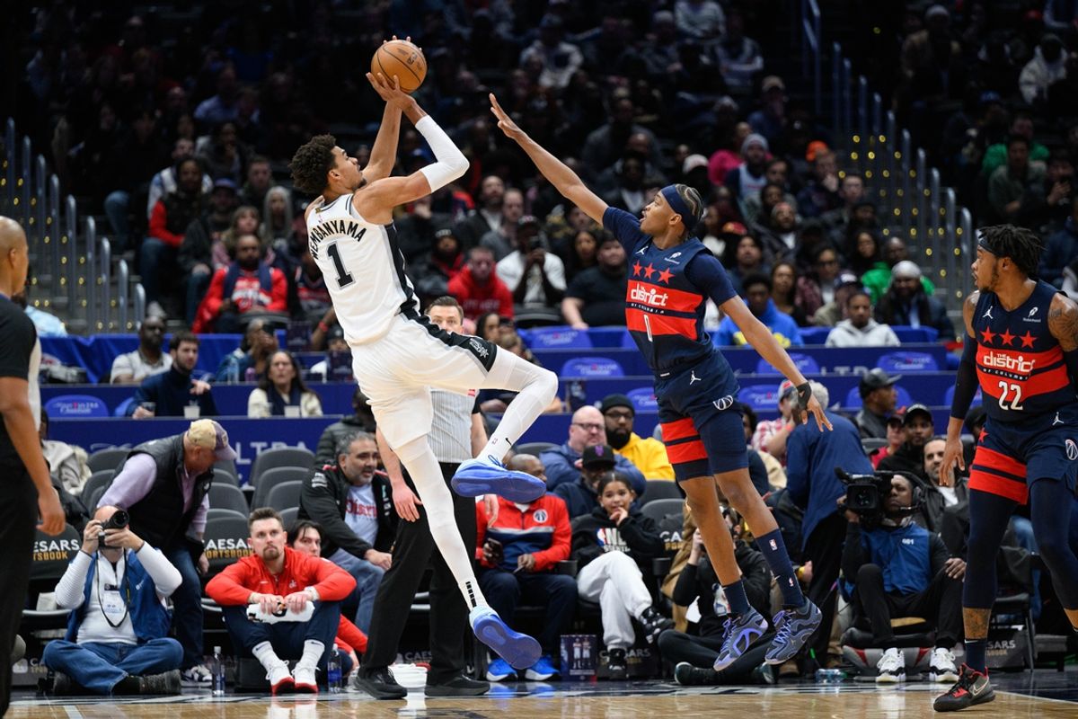 Feb 10, 2025; Washington, District of Columbia, USA; San Antonio Spurs center Victor Wembanyama (1) takes a shot over Washington Wizards guard Bilal Coulibaly (0) during the first quarter at Capital One Arena. Mandatory Credit: Reggie Hildred-Imagn Images