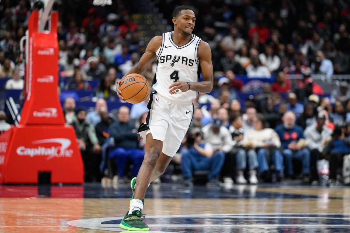 Feb 10, 2025; Washington, District of Columbia, USA; San Antonio Spurs guard De'Aaron Fox (4) handles the ball during the third quarter against the Washington Wizards at Capital One Arena. Mandatory Credit: Reggie Hildred-Imagn Images