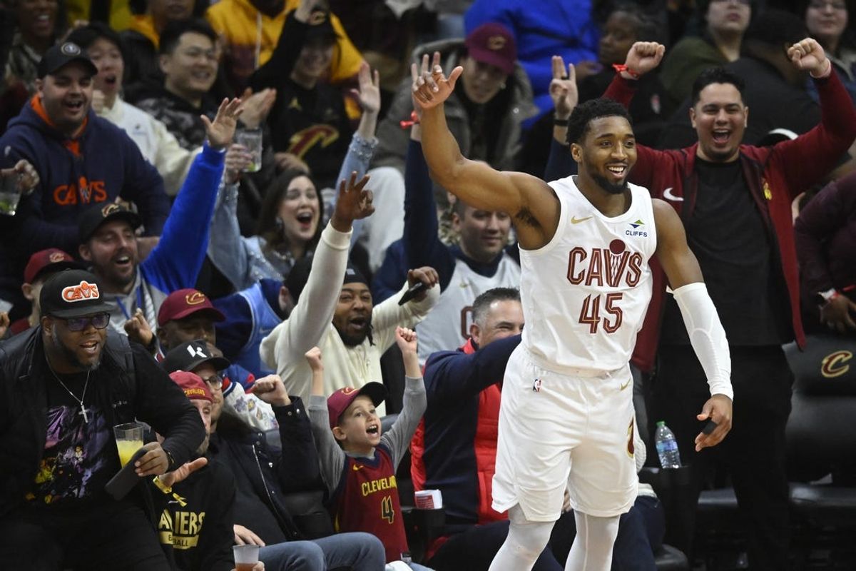 Feb 10, 2025; Cleveland, Ohio, USA; Cleveland Cavaliers guard Donovan Mitchell (45) celebrates in the third quarter against the Minnesota Timberwolves at Rocket Mortgage FieldHouse. Mandatory Credit: David Richard-Imagn Images
