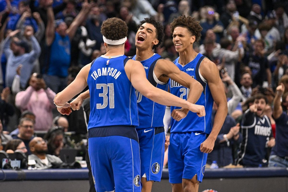 Feb 10, 2025; Dallas, Texas, USA; Dallas Mavericks guard Klay Thompson (31) and guard Max Christie (00) and forward Kessler Edwards (20) celebrates after Thompson makes a three point shot to take a one point lead during overtime against the Sacramento Kings at the American Airlines Center. Mandatory Credit: Jerome Miron-Imagn Images