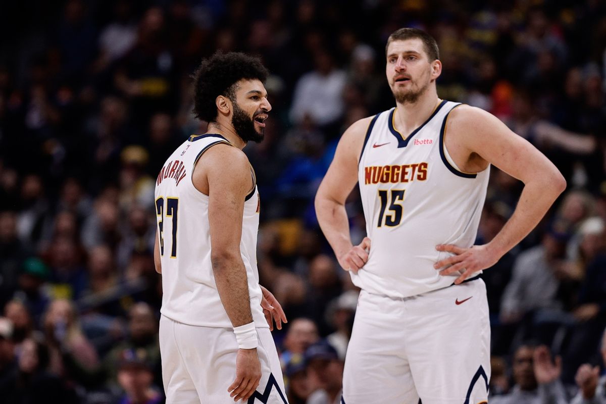 Feb 10, 2025; Denver, Colorado, USA; Denver Nuggets guard Jamal Murray (27) reacts after a call as center Nikola Jokic (15) looks on in the third quarter against the Portland Trail Blazers at Ball Arena. Mandatory Credit: Isaiah J. Downing-Imagn Images