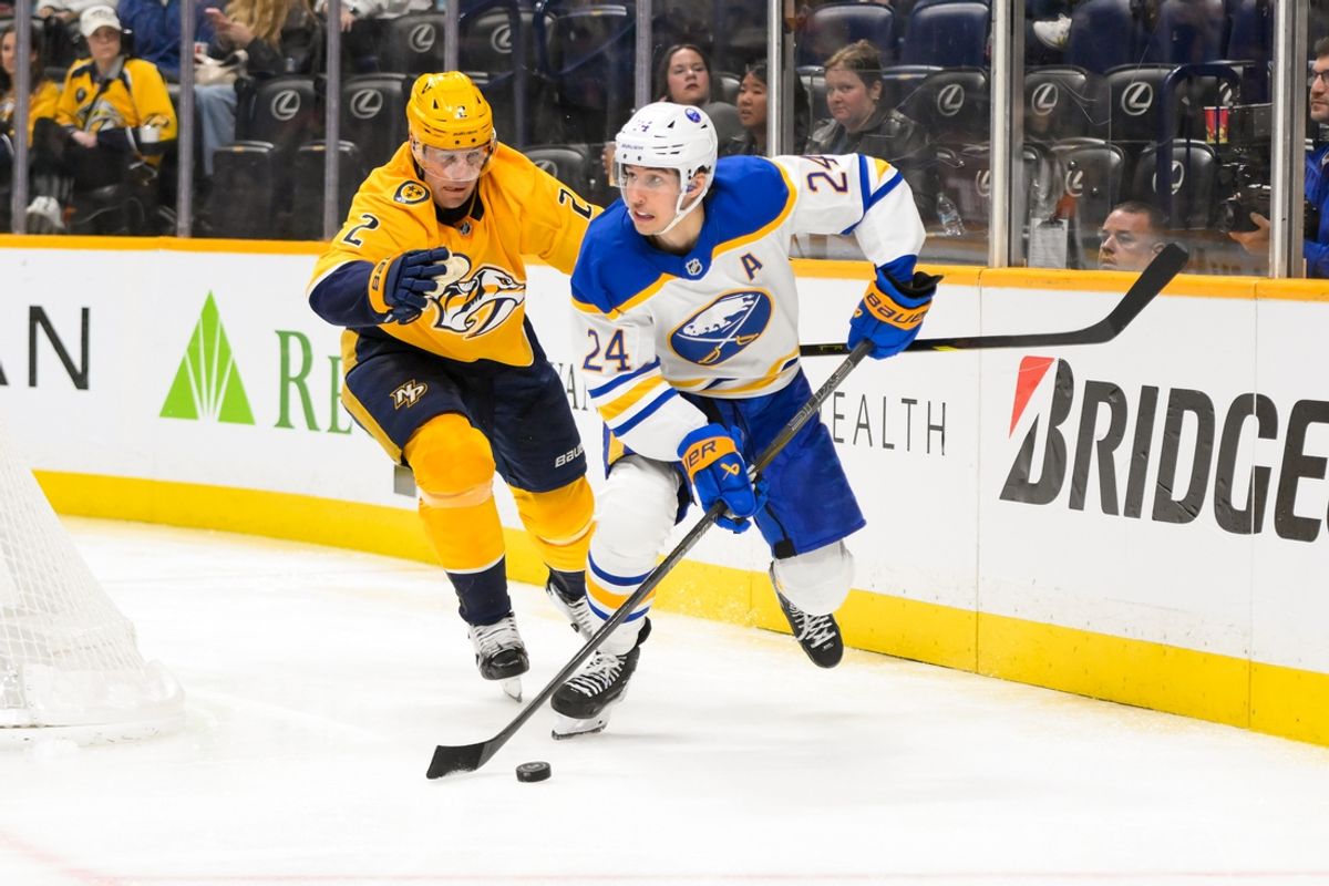 Feb 8, 2025; Nashville, Tennessee, USA;  Buffalo Sabres center Dylan Cozens (24) skates behind the net against the Nashville Predators during the second period at Bridgestone Arena. Mandatory Credit: Steve Roberts-Imagn Images