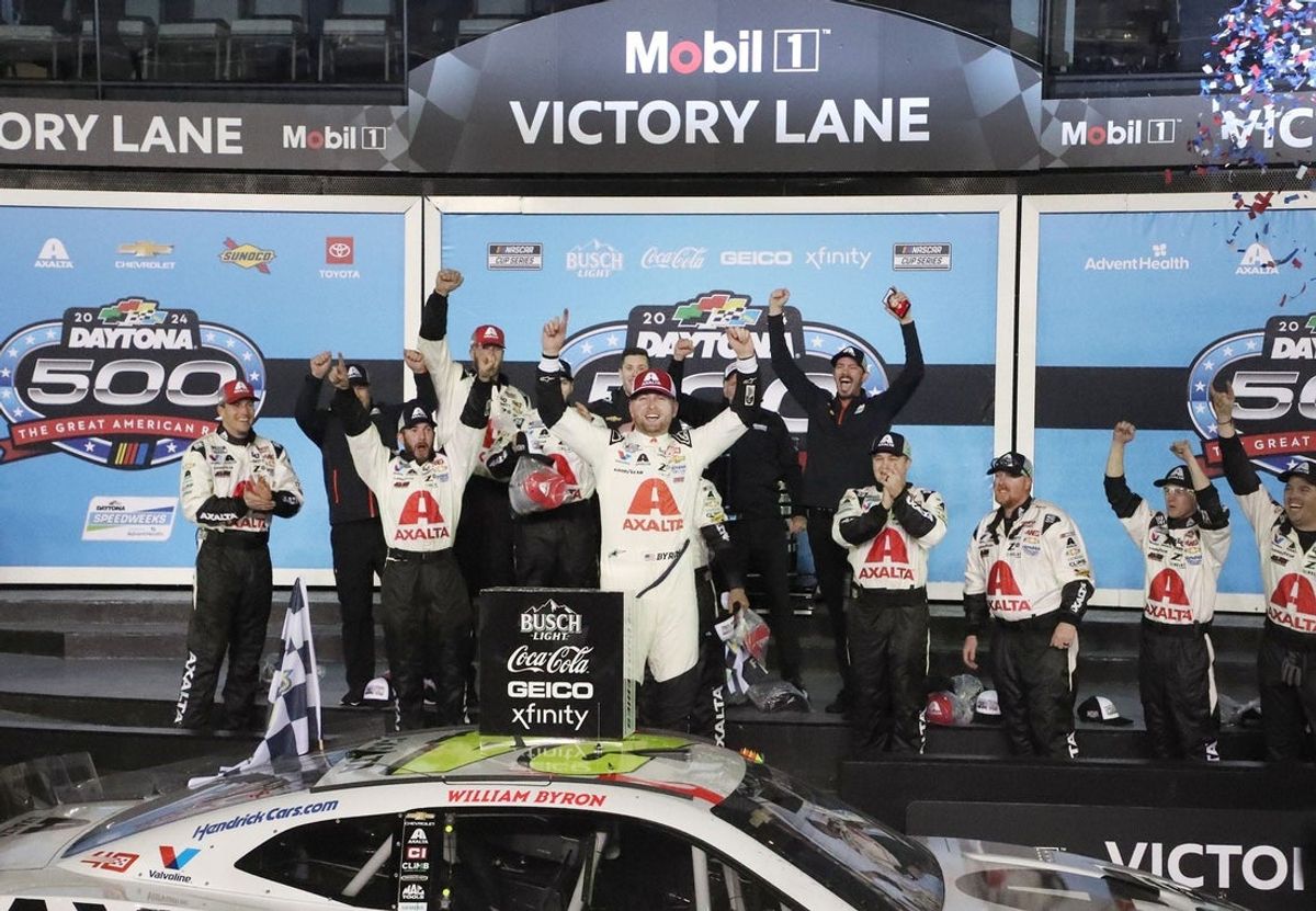 William Byron celebrates with his No. 24 Hendrick Motorsports crew after winning the 2024 Daytona 500.