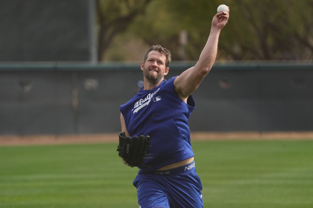 Feb 11, 2025; Glendale, AZ, USA; Los Angeles Dodgers pitcher Clayton Kershaw (22) warms up during spring training camp. Mandatory Credit: Rick Scuteri-Imagn Images