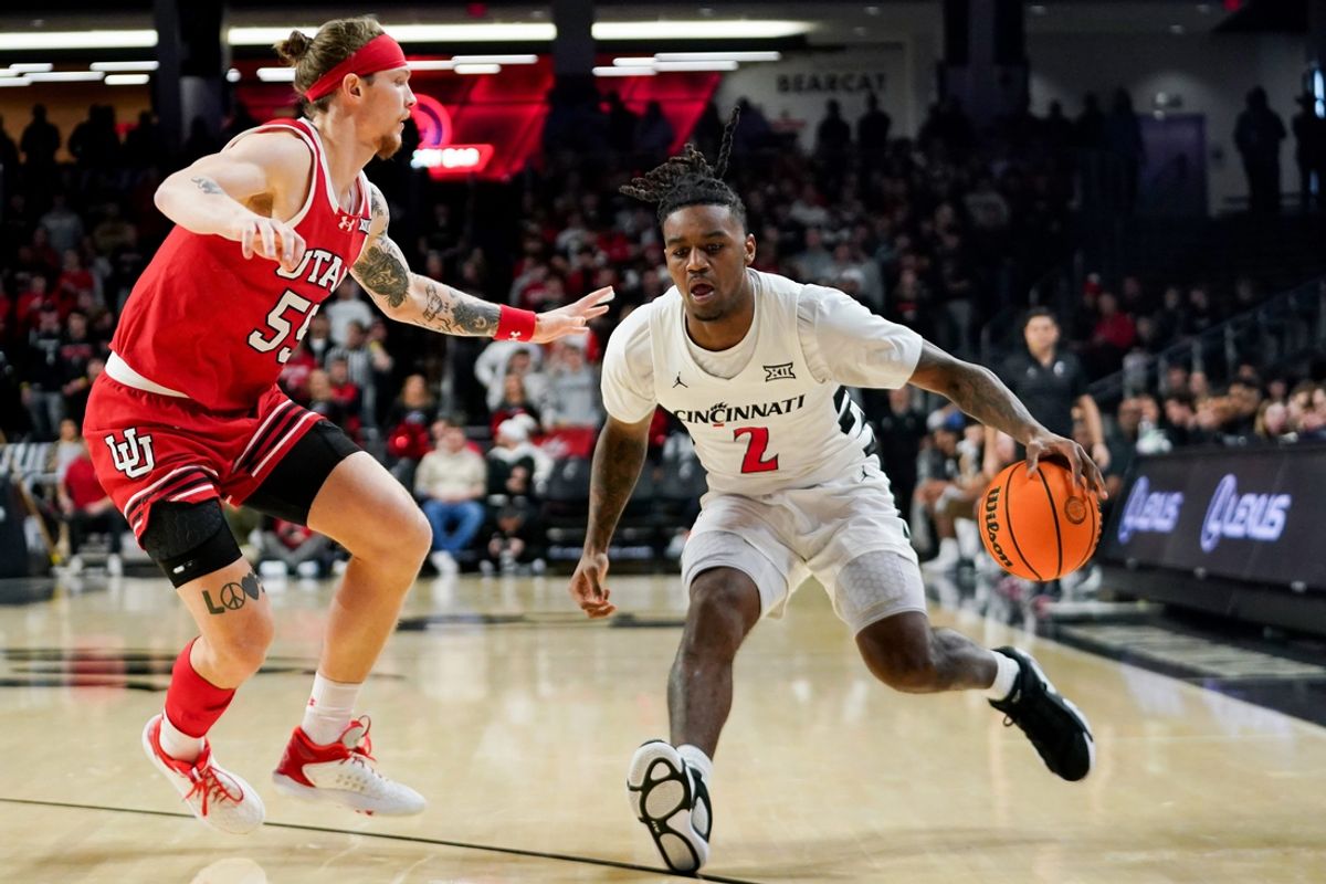 Cincinnati Bearcats guard Jizzle James (2) handles the ball in the first half of a NCAA men’s basketball game between the Cincinnati Bearcats and Utah Utes, Tuesday, Feb. 11, 2025, at Fifth Third Arena in Cincinnati.