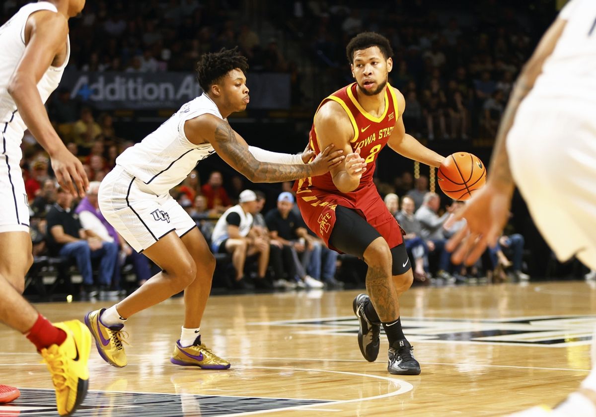 Feb 11, 2025; Orlando, Florida, USA; Iowa State Cyclones center Joshua Jefferson (2) drives to the basket against Central Florida Knights guard Jordan Ivy-Curry (0) at Addition Financial Arena. Mandatory Credit: Russell Lansford-Imagn Images