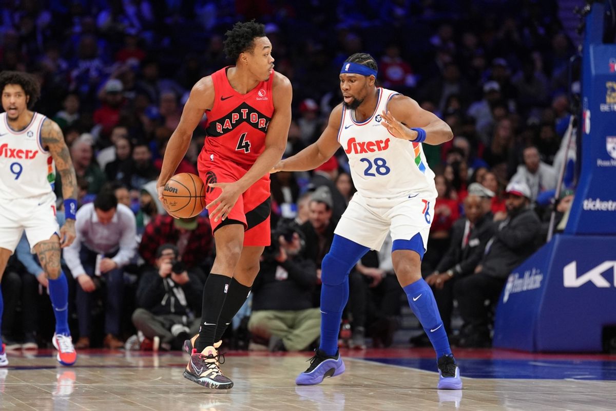 Feb 11, 2025; Philadelphia, Pennsylvania, USA; Toronto Raptors forward Scottie Barnes (4) controls the ball against Philadelphia 76ers forward Guerschon Yabusele (28) in the second quarter at Wells Fargo Center. Mandatory Credit: Kyle Ross-Imagn Images