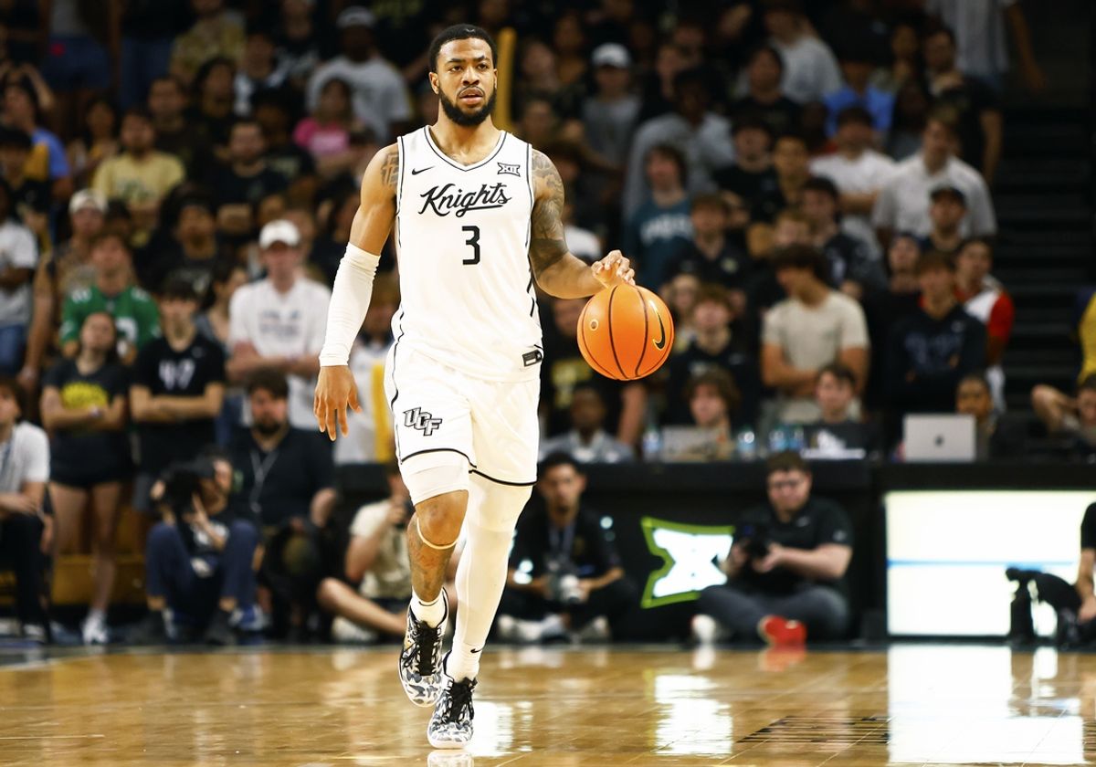 Feb 11, 2025; Orlando, Florida, USA;  Central Florida Knights guard Darius Johnson (3) dibbles the ball up the court against the Iowa State Cyclones at Addition Financial Arena. Mandatory Credit: Russell Lansford-Imagn Images