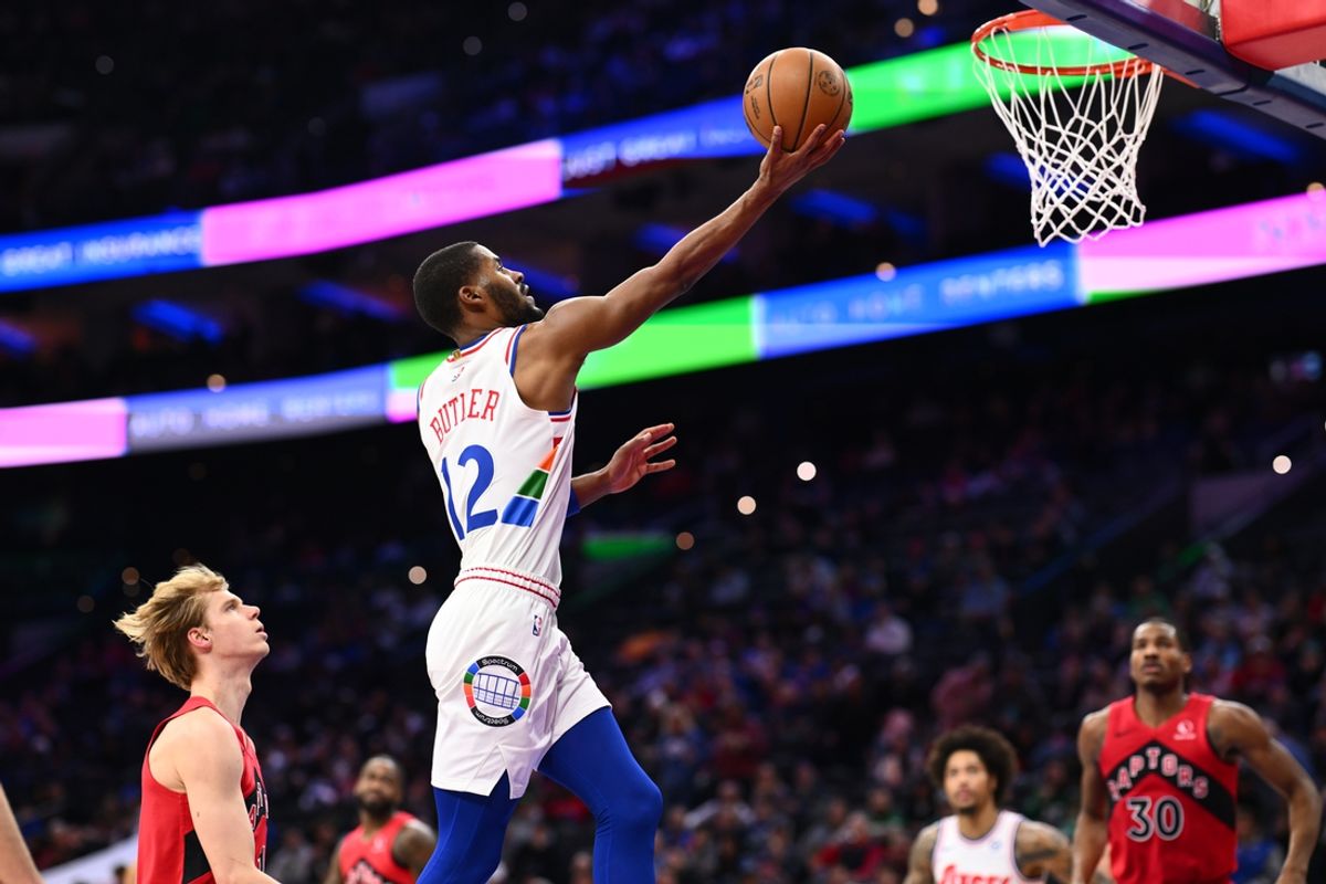 Feb 11, 2025; Philadelphia, Pennsylvania, USA; Philadelphia 76ers guard Jared Butler (12) drives to shoot against the Toronto Raptors in the second quarter at Wells Fargo Center. Mandatory Credit: Kyle Ross-Imagn Images