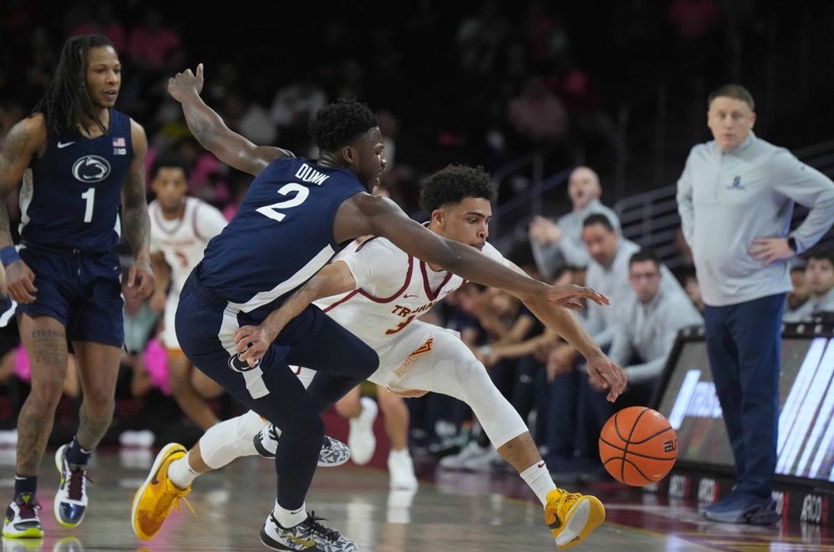 Feb 11, 2025; Los Angeles, California, USA; Penn State Nittany Lions guard D'Marco Dunn (2) and Southern California Trojans forward Matt Knowling (3) battle for the ball in the first half at Galen Center. Mandatory Credit: Kirby Lee-Imagn Images