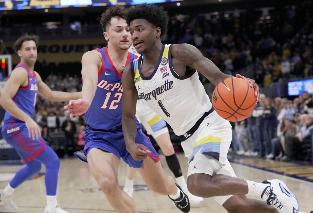 Marquette guard Kam Jones (1) drive past DePaul guard Jacob Meyer (12) during the first half of their game Tuesday, February11, 2025 at Fiserv Forum in Milwaukee, Wisconsin.