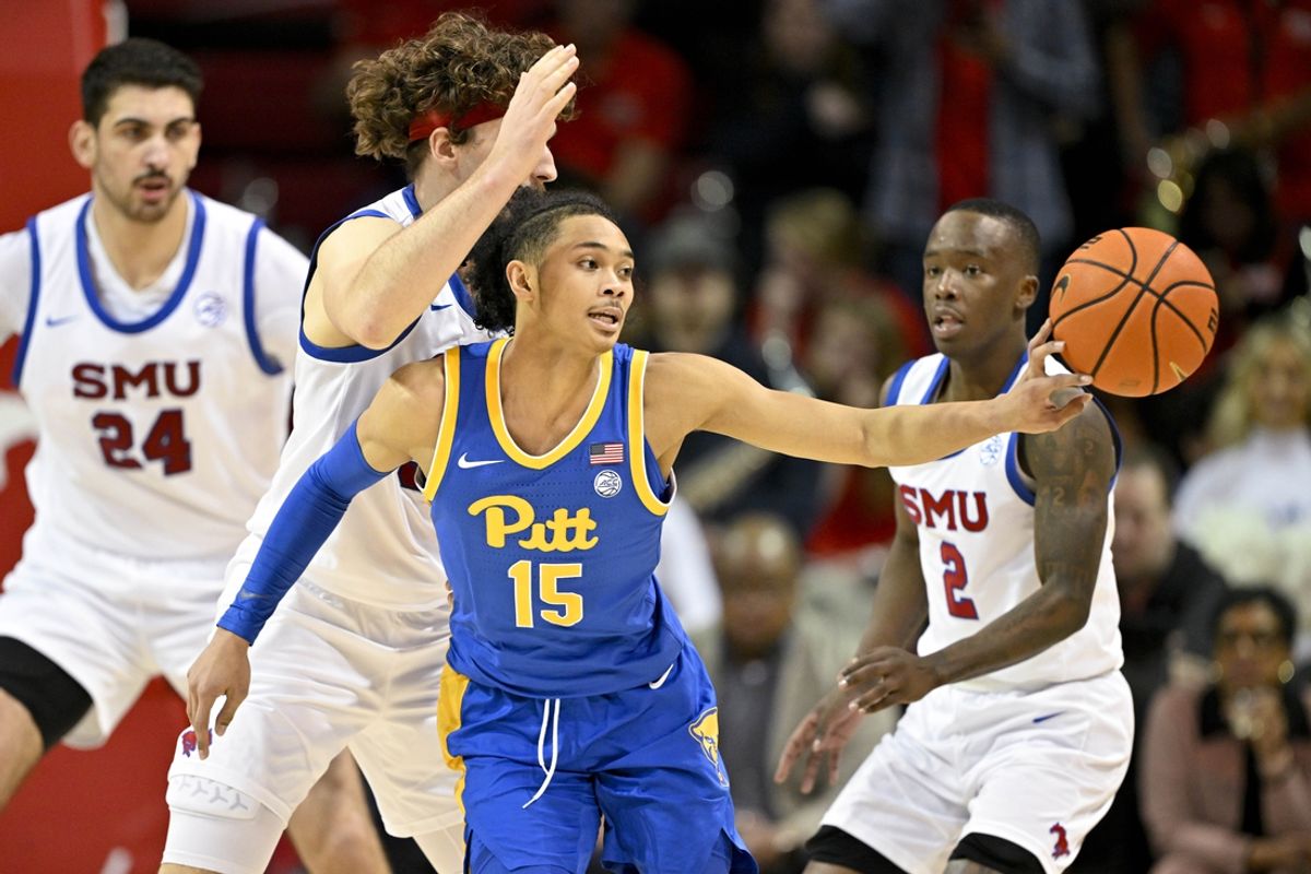 Feb 11, 2025; Dallas, Texas, USA; Pittsburgh Panthers guard Jaland Lowe (15) passes the ball by Southern Methodist Mustangs forward Matt Cross (33) during the second half at Moody Coliseum. Mandatory Credit: Jerome Miron-Imagn Images