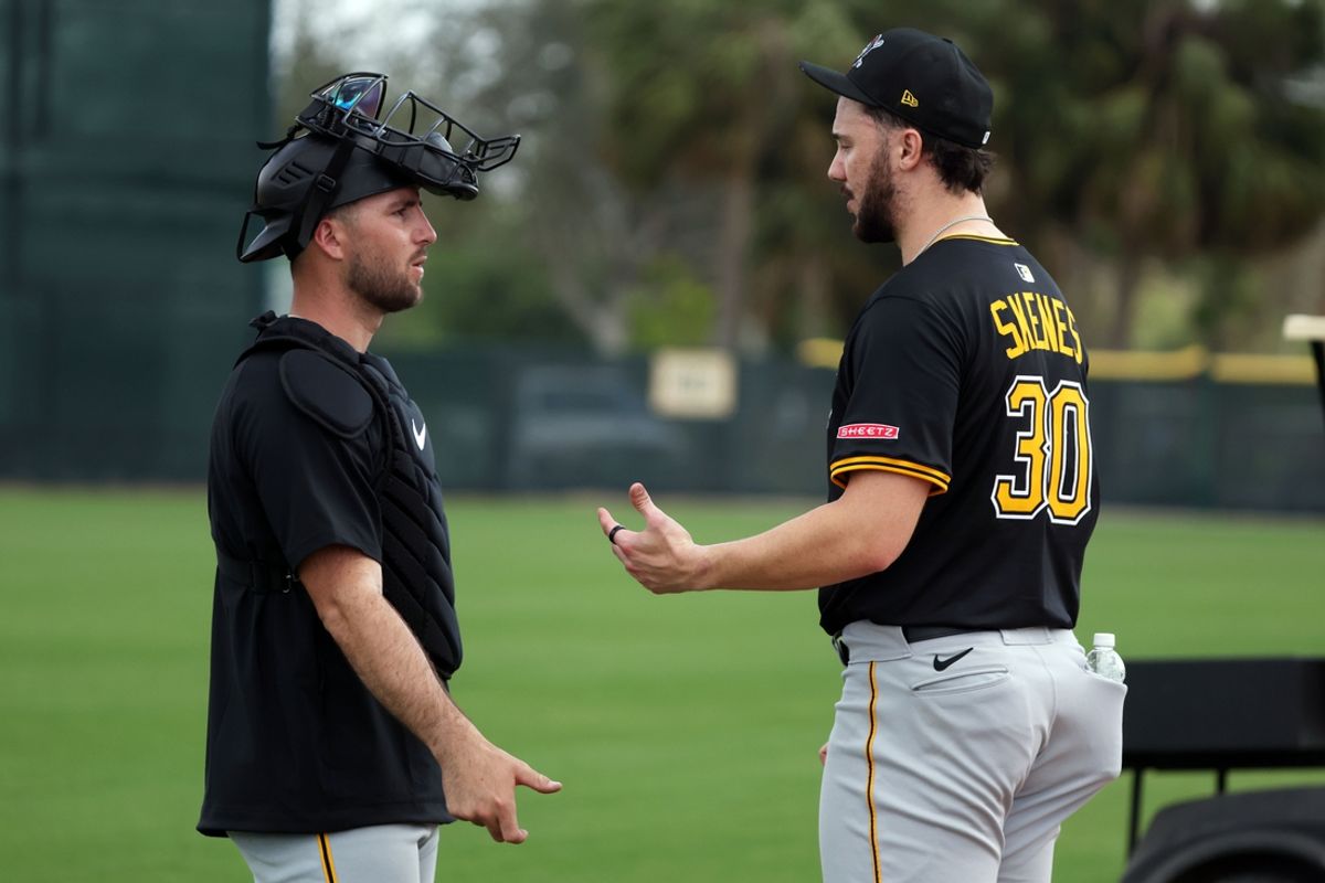 Feb 12, 2025; Bradenton, FL, USA;  Pittsburgh Pirates pitcher Paul Skenes (30) and catcher Joey Bart (14) during spring training workouts at Pirate City. Mandatory Credit: Kim Klement Neitzel-Imagn Images
