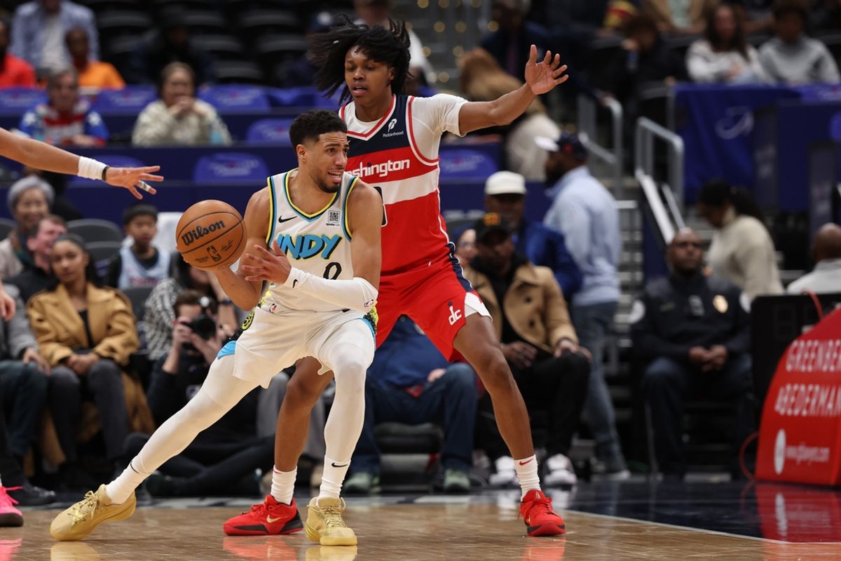 Feb 12, 2025; Washington, District of Columbia, USA; Indiana Pacers guard Tyrese Haliburton (0) drives to the basket as Washington Wizards guard Bub Carrington (8) defends in the second quarter at Capital One Arena. Mandatory Credit: Geoff Burke-Imagn Images