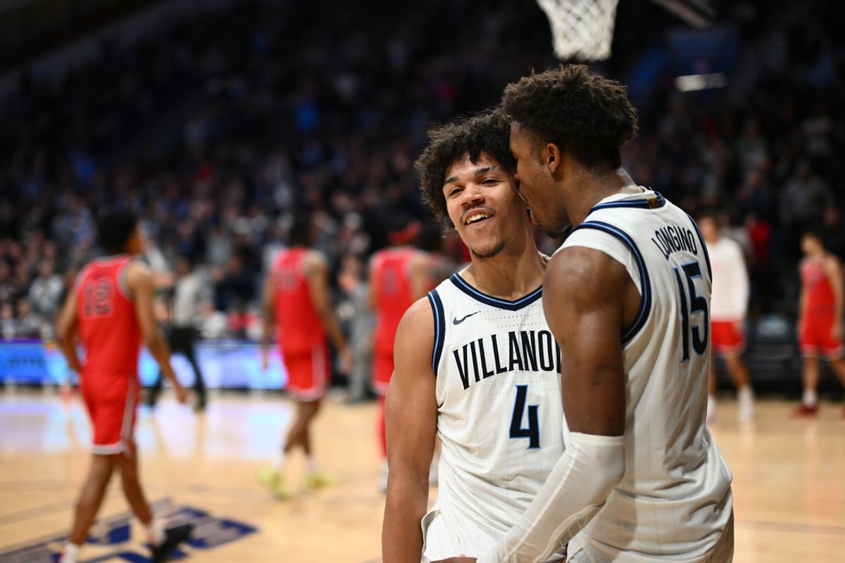 Feb 12, 2025; Villanova, Pennsylvania, USA; Villanova Wildcats guard Tyler Perkins (4) celebrates with guard Jordan Longino (15) after the game against Saint John's Red Storm at William B. Finneran Pavilion. Mandatory Credit: Kyle Ross-Imagn Images