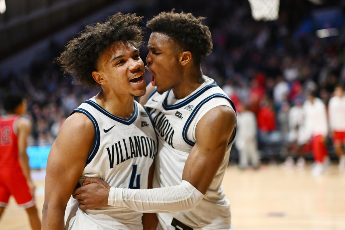 Feb 12, 2025; Villanova, Pennsylvania, USA; Villanova Wildcats guard Tyler Perkins (4) celebrates with guard Jordan Longino (15) after the game against Saint John's Red Storm at William B. Finneran Pavilion. Mandatory Credit: Kyle Ross-Imagn Images