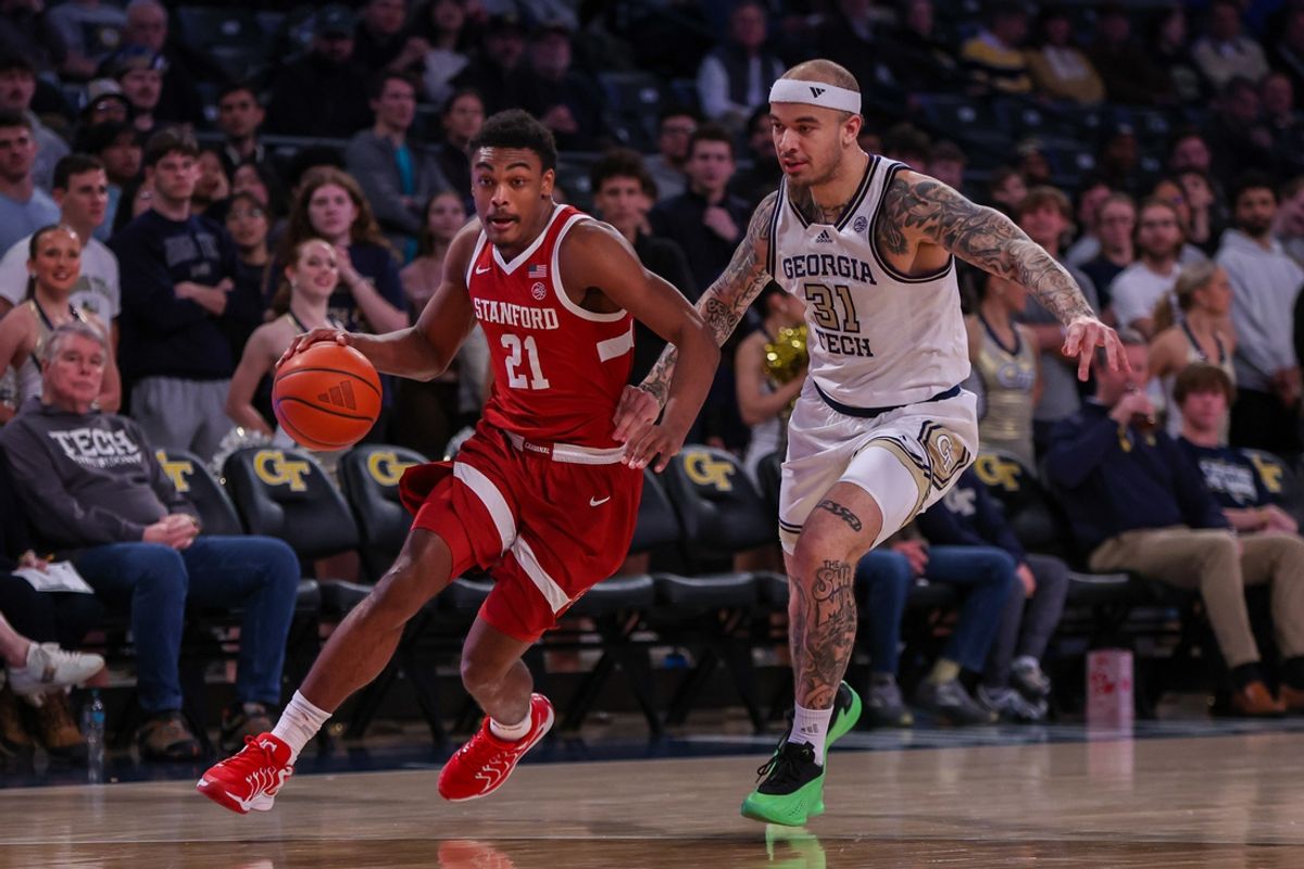 Feb 12, 2025; Atlanta, Georgia, USA; Stanford Cardinal guard Jaylen Blakes (21) drives past Georgia Tech Yellow Jackets forward Duncan Powell (31) in the first half at McCamish Pavilion. Mandatory Credit: Brett Davis-Imagn Images