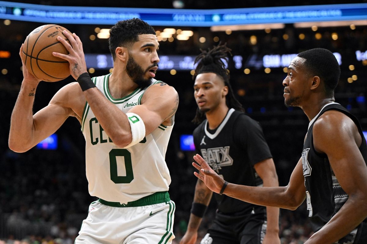 Feb 12, 2025; Boston, Massachusetts, USA; Boston Celtics forward Jayson Tatum (0) drives to the basket against San Antonio Spurs guard De'Aaron Fox (4) during the third quarter at the TD Garden. Mandatory Credit: Brian Fluharty-Imagn Images