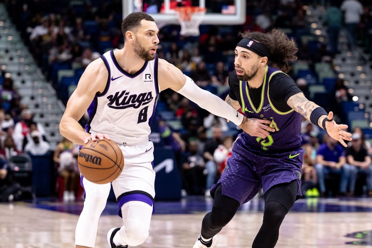 Feb 12, 2025; New Orleans, Louisiana, USA;  Sacramento Kings guard Zach LaVine (8) dribbles against New Orleans Pelicans guard Jose Alvarado (15) during the first half at Smoothie King Center. Mandatory Credit: Stephen Lew-Imagn Images