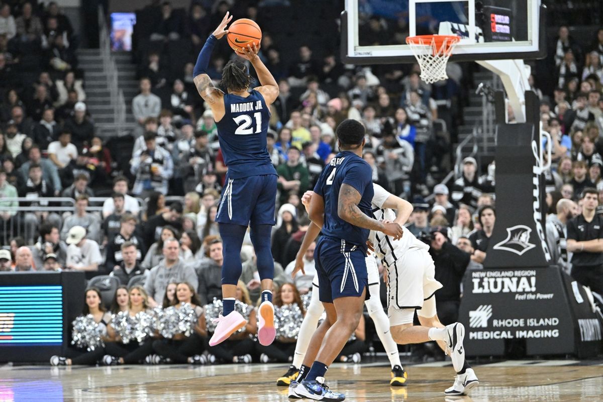 Feb 12, 2025; Providence, Rhode Island, USA; Xavier Musketeers guard Dante Maddox Jr. (21) shoots the ball against the Providence Friars during the first half at Amica Mutual Pavilion. Mandatory Credit: Eric Canha-Imagn Images
