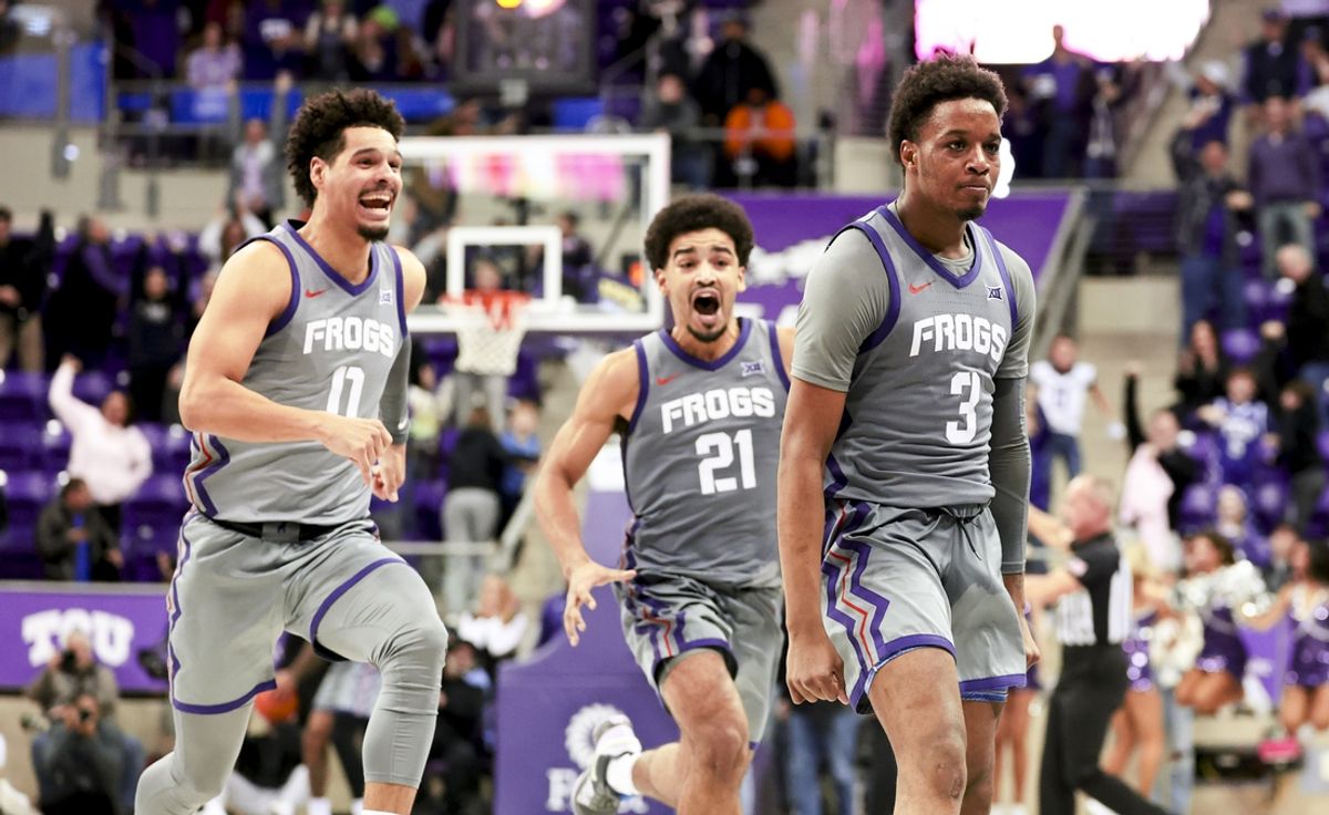 Feb 12, 2025; Fort Worth, Texas, USA; TCU Horned Frogs guard Vasean Allette (3) celebrates with TCU Horned Frogs guard Brendan Wenzel (0) and TCU Horned Frogs guard Noah Reynolds (21) after hitting the game-winning shot during the second half against the Oklahoma State Cowboys at Ed and Rae Schollmaier Arena. Mandatory Credit: Kevin Jairaj-Imagn Images