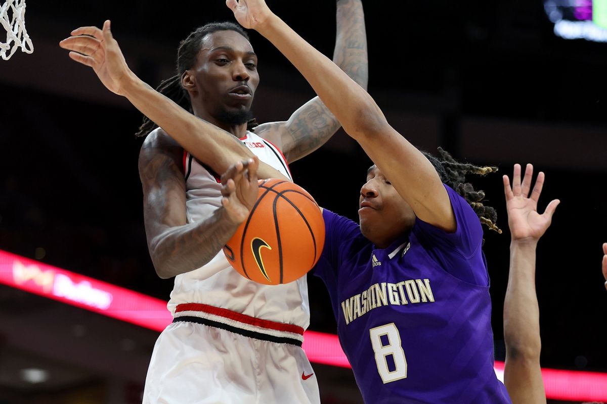 Feb 12, 2025; Columbus, Ohio, USA; Washington Huskies guard Tyler Harris (8) drives to the basket as Ohio State Buckeyes forward Aaron Bradshaw (4) defends during the first half at Value City Arena. Mandatory Credit: Joseph Maiorana-Imagn Images