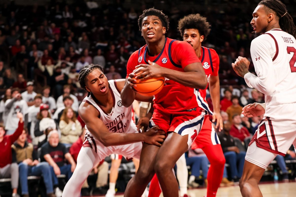 Feb 12, 2025; Columbia, South Carolina, USA; Mississippi Rebels forward Malik Dia (0) drives past South Carolina Gamecocks forward Collin Murray-Boyles (30) in the second half at Colonial Life Arena. Mandatory Credit: Jeff Blake-Imagn Images