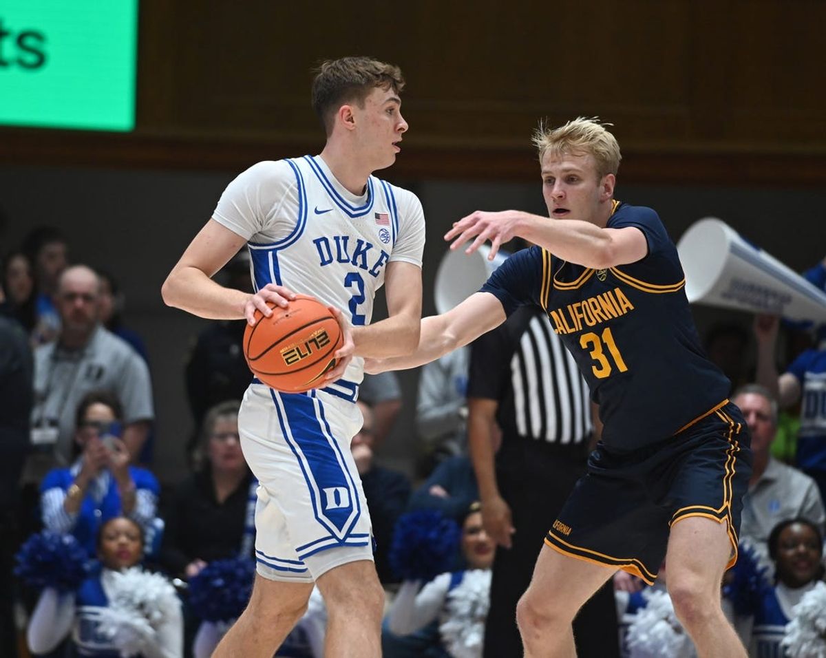 Feb 12, 2025; Durham, North Carolina, USA;  Duke Blue Devils forward Cooper Flagg (2) controls the ball in front of California Golden Bears forward Rytis Petraitis (31) at Cameron Indoor Stadium. Mandatory Credit: Rob Kinnan-Imagn Images