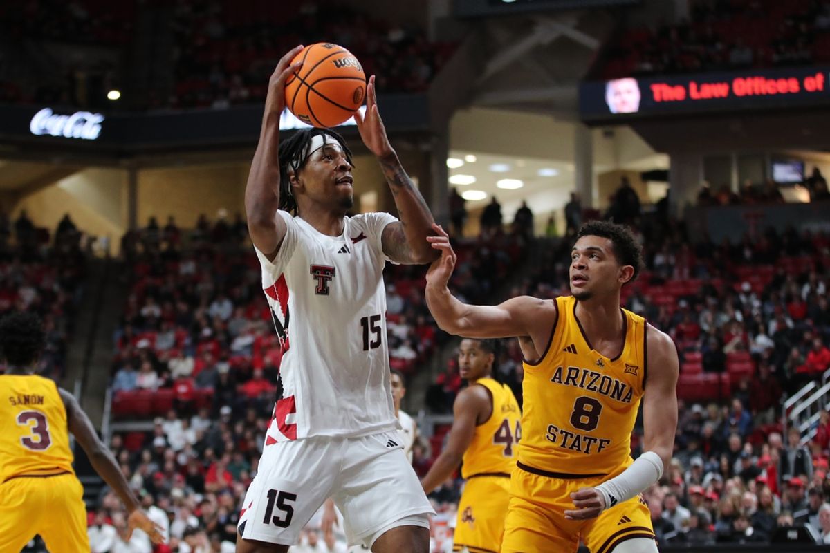 Feb 12, 2025; Lubbock, Texas, USA; Texas Tech Red Raiders forward JT Toppin (15) goes to the basket against Arizona State Sun Devils forward Basheer Jihad (8) in the first half at United Supermarkets Arena. Mandatory Credit: Michael C. Johnson-Imagn Images