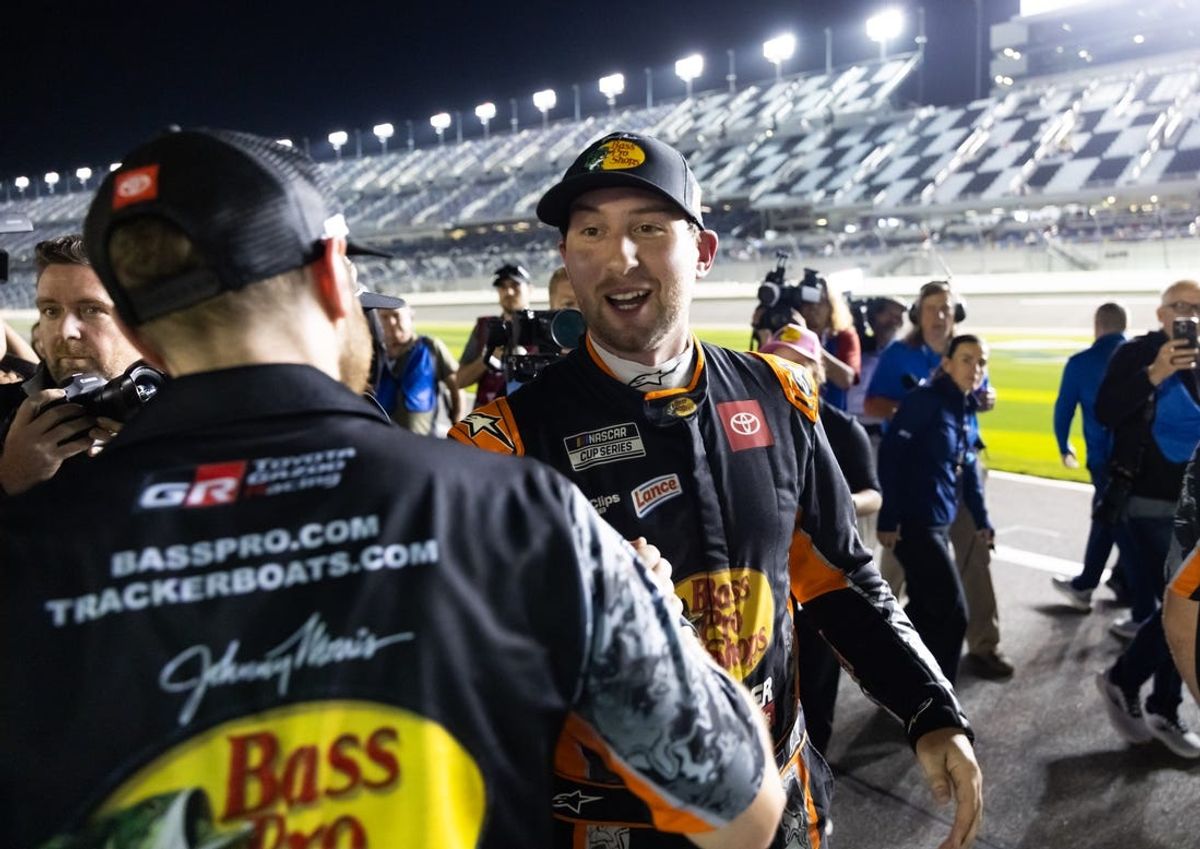 Feb 12, 2025; Daytona Beach, Florida, USA; NASCAR Cup Series driver Chase Briscoe (19) celebrates with teammates after winning the pole during qualifying for the Daytona 500 at Daytona International Speedway. Mandatory Credit: Mark J. Rebilas-Imagn Images