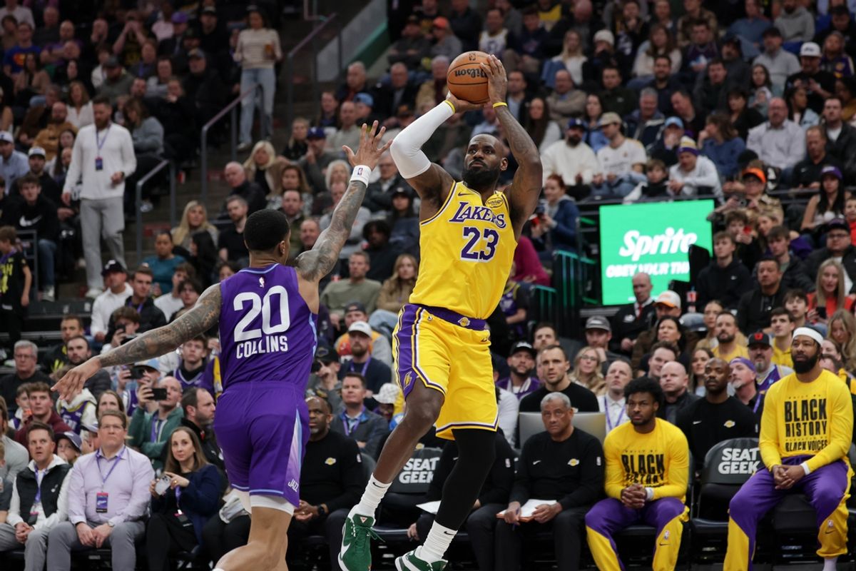 Feb 12, 2025; Salt Lake City, Utah, USA;  Los Angeles Lakers forward LeBron James (23) shoots over Utah Jazz forward John Collins (20) during the second quarter at Delta Center. Mandatory Credit: Chris Nicoll-Imagn Images